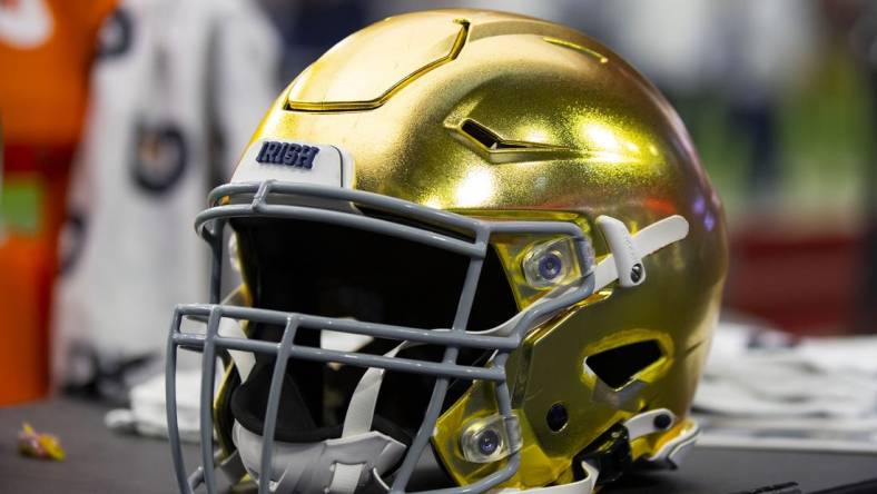 Jan 1, 2022; Glendale, Arizona, USA; Detailed view of a gold Notre Dame Fighting Irish helmet during the 2022 Fiesta Bowl at State Farm Stadium. Mandatory Credit: Mark J. Rebilas-USA TODAY Sports