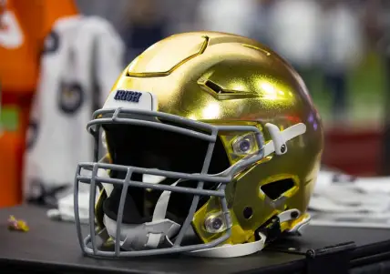 Jan 1, 2022; Glendale, Arizona, USA; Detailed view of a gold Notre Dame Fighting Irish helmet during the 2022 Fiesta Bowl at State Farm Stadium. Mandatory Credit: Mark J. Rebilas-USA TODAY Sports