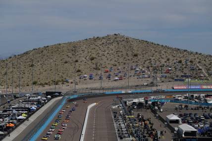 Mar 13, 2022; Avondale, Arizona, USA; General view as NASCAR Cup Series driver Kyle Busch (18) and driver Ryan Blaney (12) lead the field for the restart of the Ruoff Mortgage 500 at Phoenix Raceway. Mandatory Credit: Gary A. Vasquez-USA TODAY Sports