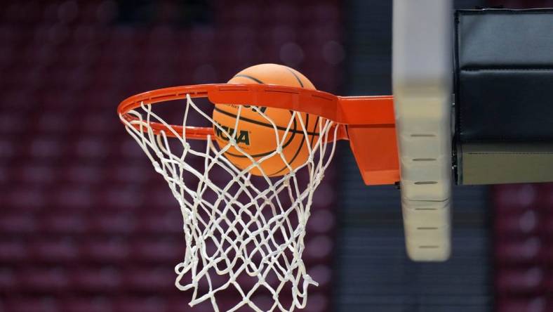 Mar 17, 2022; San Diego, CA, USA; A general view as a basketball goes through the rim and net during practice before the first round of the 2022 NCAA Tournament at Viejas Arena. Mandatory Credit: Kirby Lee-USA TODAY Sports