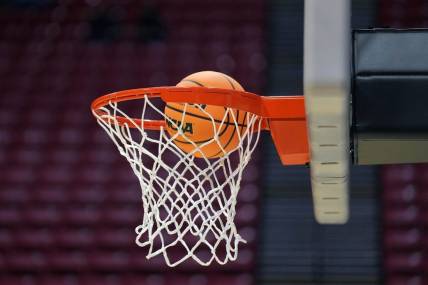 Mar 17, 2022; San Diego, CA, USA; A general view as a basketball goes through the rim and net during practice before the first round of the 2022 NCAA Tournament at Viejas Arena. Mandatory Credit: Kirby Lee-USA TODAY Sports