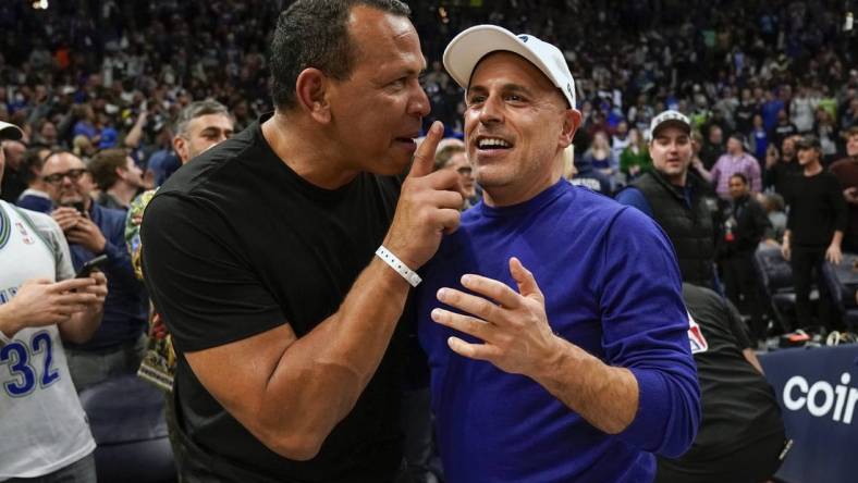 Apr 12, 2022; Minneapolis, Minnesota, USA;  Minnesota Timberwolves co-minority owners Alex Rodriguez and Marc Lore celebrate a victory over the Los Angeles Clippers after a play-in game at Target Center. Mandatory Credit: Nick Wosika-USA TODAY Sports