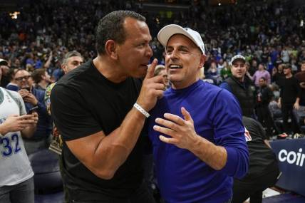 Apr 12, 2022; Minneapolis, Minnesota, USA;  Minnesota Timberwolves co-minority owners Alex Rodriguez and Marc Lore celebrate a victory over the Los Angeles Clippers after a play-in game at Target Center. Mandatory Credit: Nick Wosika-USA TODAY Sports