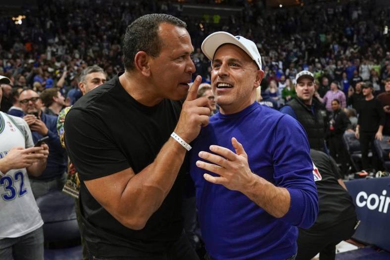 Apr 12, 2022; Minneapolis, Minnesota, USA;  Minnesota Timberwolves co-minority owners Alex Rodriguez and Marc Lore celebrate a victory over the Los Angeles Clippers after a play-in game at Target Center. Mandatory Credit: Nick Wosika-USA TODAY Sports
