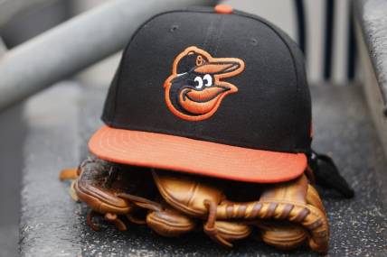 May 14, 2022; Detroit, Michigan, USA;  Baltimore Orioles cap and glove sits in dugout in the second inning against the Detroit Tigers at Comerica Park. Mandatory Credit: Rick Osentoski-USA TODAY Sports