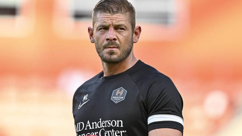 Jun 12, 2022; Houston, Texas, USA; Houston Dash goalkeeper coach Matt Lampson enters the pitch prior to the start of the second half against the Portland Thorns FC in a NWSL match at PNC Stadium. Mandatory Credit: Maria Lysaker-USA TODAY Sports