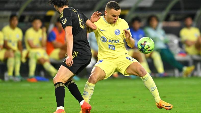 Aug 3, 2022; Los Angeles, California, US;   LAFC midfielder Ilie Sanchez (6) and Club America forward Jonathan Rodriguez (11) battle for the ball in the second half at SoFi Stadium. Mandatory Credit: Jayne Kamin-Oncea-USA TODAY Sports