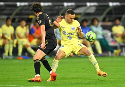 Aug 3, 2022; Los Angeles, California, US;   LAFC midfielder Ilie Sanchez (6) and Club America forward Jonathan Rodriguez (11) battle for the ball in the second half at SoFi Stadium. Mandatory Credit: Jayne Kamin-Oncea-USA TODAY Sports