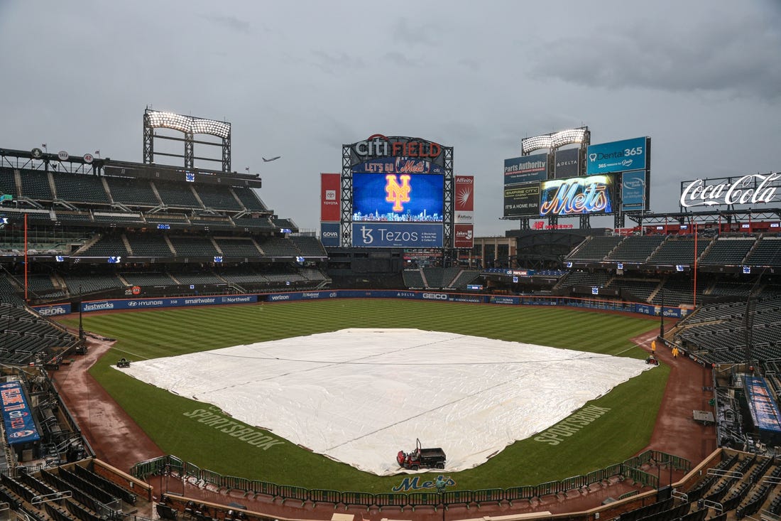 Oct 3, 2022; New York City, New York, USA; A general view of the tarp on the field before the game between the New York Mets and the Washington Nationals at Citi Field. Mandatory Credit: Vincent Carchietta-USA TODAY Sports