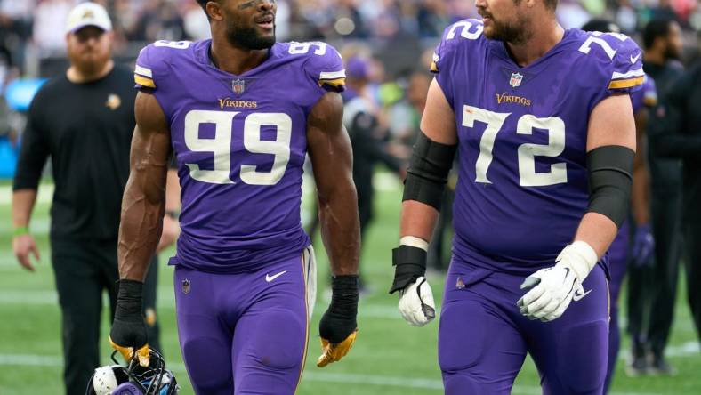 Oct 2, 2022;  London, United Kingdom;  Minnesota Vikings linebacker Danielle Hunter (99) and Minnesota Vikings guard Ezra Cleveland (72) during the NFL International Series game at Tottenham Hotspur Stadium. Mandatory Credit: Peter van den Berg-USA TODAY Sports