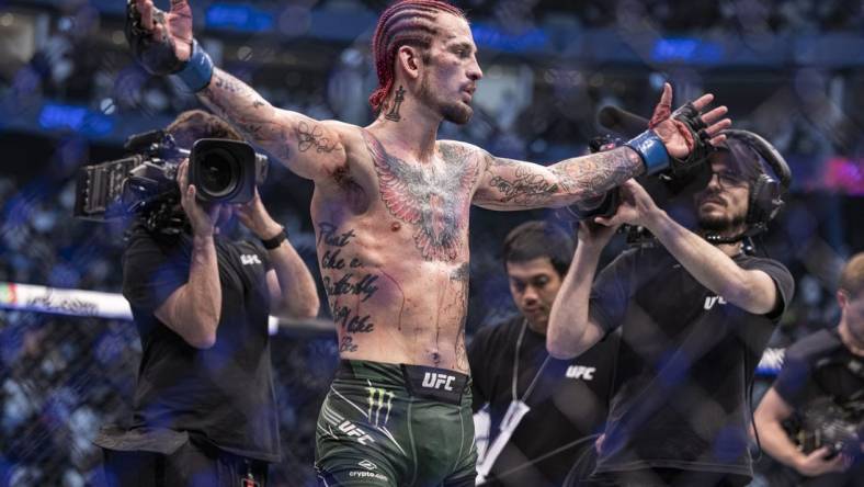 Oct 22, 2022; Abu Dhabi, UAE;  Sean O'Malley (blue gloves) defeats Petr Yan (red gloveS) during UFC 280 at Etihad Arena. Mandatory Credit: Craig Kidwell-USA TODAY Sports