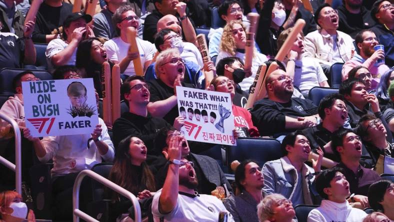 Nov 5, 2022; San Francisco, California, USA; Fans hold signs for T1 mid laner Lee "Faker" Sang-hyeok (not pictured) during the League of Legends World Championships against DRX at Chase Center. Mandatory Credit: Kelley L Cox-USA TODAY Sports