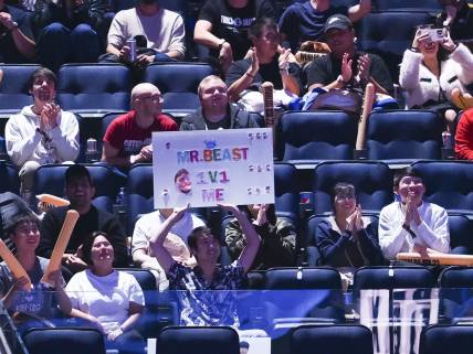 Nov 5, 2022; San Francisco, California, USA; A fan holds a sign during the League of Legends World Championships between T1 and DRX at Chase Center. Mandatory Credit: Kelley L Cox-USA TODAY Sports