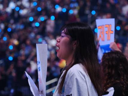 Nov 5, 2022; San Francisco, California, USA;  A DRX fan with visible tears after DRX won the League of Legends World Championships against T1 at Chase Center. Mandatory Credit: Kelley L Cox-USA TODAY Sports