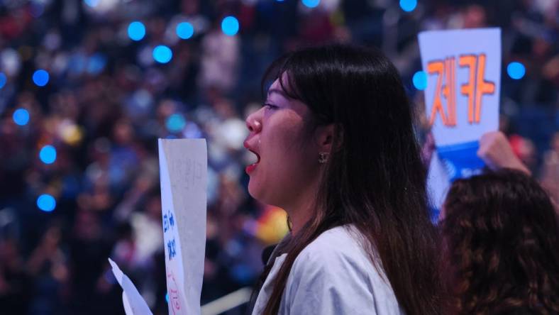 Nov 5, 2022; San Francisco, California, USA;  A DRX fan with visible tears after DRX won the League of Legends World Championships against T1 at Chase Center. Mandatory Credit: Kelley L Cox-USA TODAY Sports