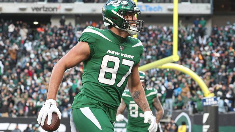 New York Jets tight end C.J. Uzomah (87) celebrates his touchdown reception against the Detroit Lions during the second half at MetLife Stadium. Mandatory Credit: Vincent Carchietta-USA TODAY Sports