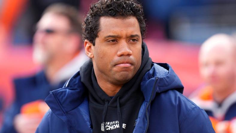 Dec 18, 2022; Denver, Colorado, USA; Denver Broncos quarterback Russell Wilson (3) on the sidelines before the start of the game against the Arizona Cardinals at Empower Field at Mile High. Mandatory Credit: Ron Chenoy-USA TODAY Sports