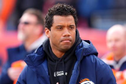 Dec 18, 2022; Denver, Colorado, USA; Denver Broncos quarterback Russell Wilson (3) on the sidelines before the start of the game against the Arizona Cardinals at Empower Field at Mile High. Mandatory Credit: Ron Chenoy-USA TODAY Sports