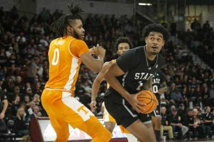 Jan 17, 2023; Starkville, Mississippi, USA; Mississippi State Bulldogs forward Tolu Smith (1) spins toward the basket as Tennessee Volunteers forward Jonas Aidoo (0) defends during the second half at Humphrey Coliseum. Mandatory Credit: Petre Thomas-USA TODAY Sports