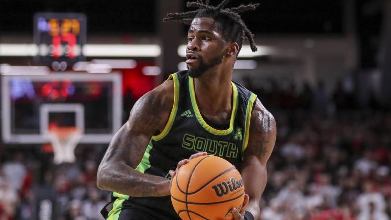 Feb 11, 2023; Cincinnati, Ohio, USA; South Florida Bulls guard Selton Miguel (1) holds the ball against the Cincinnati Bearcats in the second half at Fifth Third Arena. Mandatory Credit: Katie Stratman-USA TODAY Sports