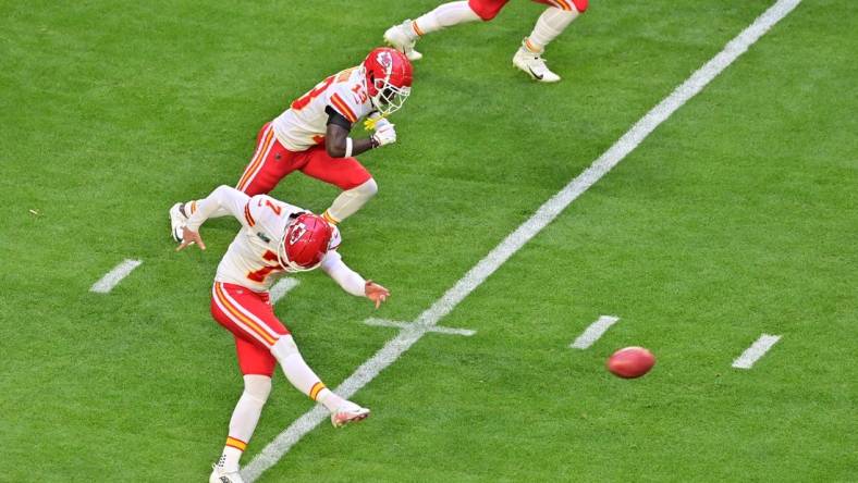 Feb 12, 2023; Glendale, Arizona, US; Kansas City Chiefs place kicker Harrison Butker (7) kicks off against the Philadelphia Eagles to start Super Bowl LVII at State Farm Stadium. Mandatory Credit: Matt Kartozian-USA TODAY Sports