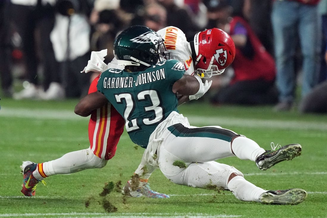 Feb 12, 2023; Glendale, Arizona, US; Philadelphia Eagles safety C.J. Gardner-Johnson (23) tackles Kansas City Chiefs running back Jerick McKinnon (1) in the third quarter of Super Bowl LVII at State Farm Stadium. Mandatory Credit: Joe Camporeale-USA TODAY Sports