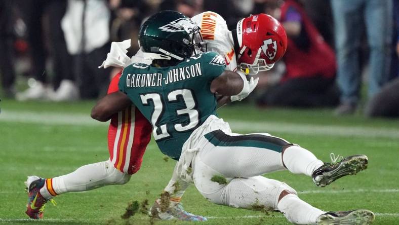 Feb 12, 2023; Glendale, Arizona, US; Philadelphia Eagles safety C.J. Gardner-Johnson (23) tackles Kansas City Chiefs running back Jerick McKinnon (1) in the third quarter of Super Bowl LVII at State Farm Stadium. Mandatory Credit: Joe Camporeale-USA TODAY Sports