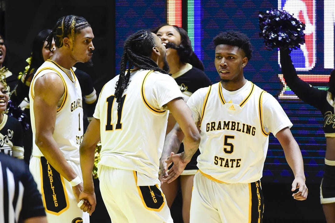 Feb 18, 2023; Salt Lake City, Utah, USA; Grambling State University Tigers forward Jourdan Smith (11) celebrates after a basket by guard Tra'Michael Moton (5) against the Southern University Jaguars during overtime at the Jon M. Huntsman Center. Mandatory Credit: Christopher Creveling-USA TODAY Sports