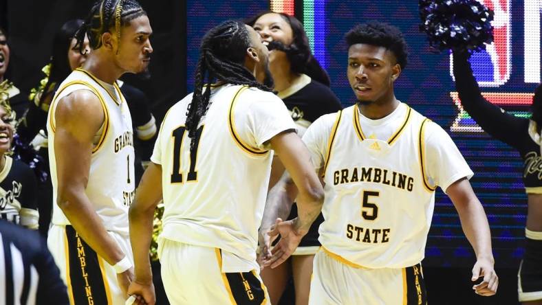 Feb 18, 2023; Salt Lake City, Utah, USA; Grambling State University Tigers forward Jourdan Smith (11) celebrates after a basket by guard Tra'Michael Moton (5) against the Southern University Jaguars during overtime at the Jon M. Huntsman Center. Mandatory Credit: Christopher Creveling-USA TODAY Sports