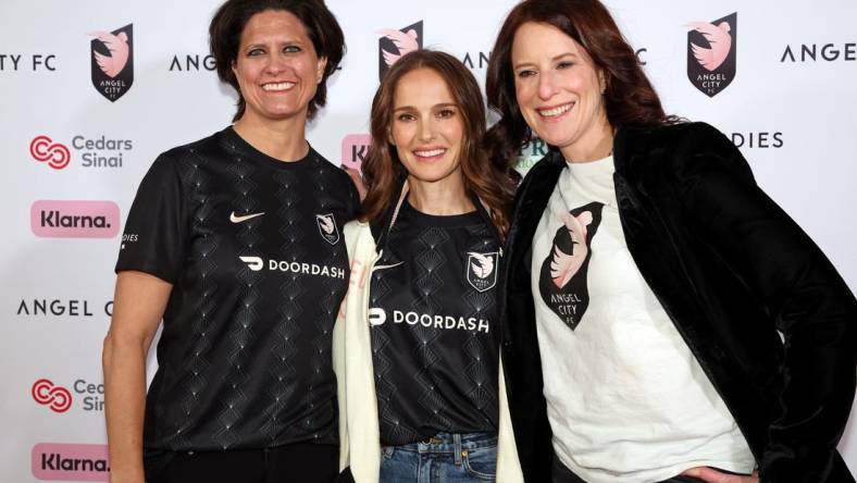 Mar 26, 2023; Los Angeles, California, USA; 
Angel City FC co-founder Julie Uhrman (left) and co-founder Natalie Portman (center) and co-founder Kara Nortman pose for a photo on the pink carpet before the game against New Jersey/New York Gotham FC at BMO Stadium. Mandatory Credit: Kiyoshi Mio-USA TODAY Sports