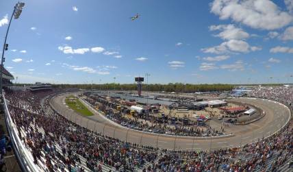 Apr 2, 2023; Richmond, Virginia, USA; A US Coast Guard C-130 performs a flyby before the start of the Toyota Owners 400 in this overall view of Richmond Raceway. Mandatory Credit: John David Mercer-USA TODAY Sports