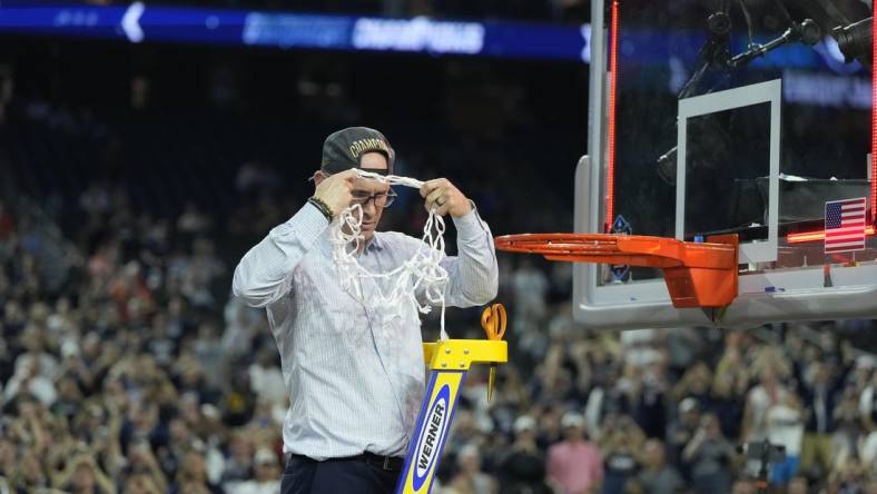 Apr 3, 2023; Houston, TX, USA; Connecticut Huskies head coach Dan Hurley celebrates after cutting down the net after defeating the San Diego State Aztecs in the national championship game of the 2023 NCAA Tournament at NRG Stadium. Mandatory Credit: Bob Donnan-USA TODAY Sports