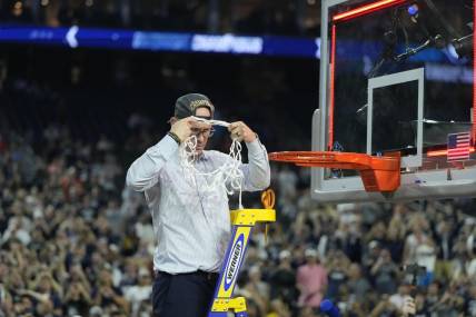 Apr 3, 2023; Houston, TX, USA; Connecticut Huskies head coach Dan Hurley celebrates after cutting down the net after defeating the San Diego State Aztecs in the national championship game of the 2023 NCAA Tournament at NRG Stadium. Mandatory Credit: Bob Donnan-USA TODAY Sports