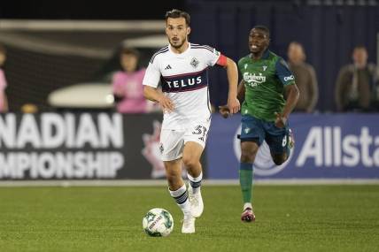 May 10, 2023; Toronto, Ontario, CAN; Vancouver Whitecaps midfielder Russell Teibert (31) dribbles the ball downfield against York United  during the second half at York Lions Stadium. Mandatory Credit: John E. Sokolowski-USA TODAY Sports