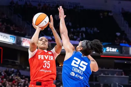 May 19, 2023; Indianapolis, Indiana, USA; Indiana Fever guard Victoria Vivians (35) shoots the ball while Connecticut Sun forward Alyssa Thomas (25) defends in the second half at Gainbridge Fieldhouse. Mandatory Credit: Trevor Ruszkowski-USA TODAY Sports