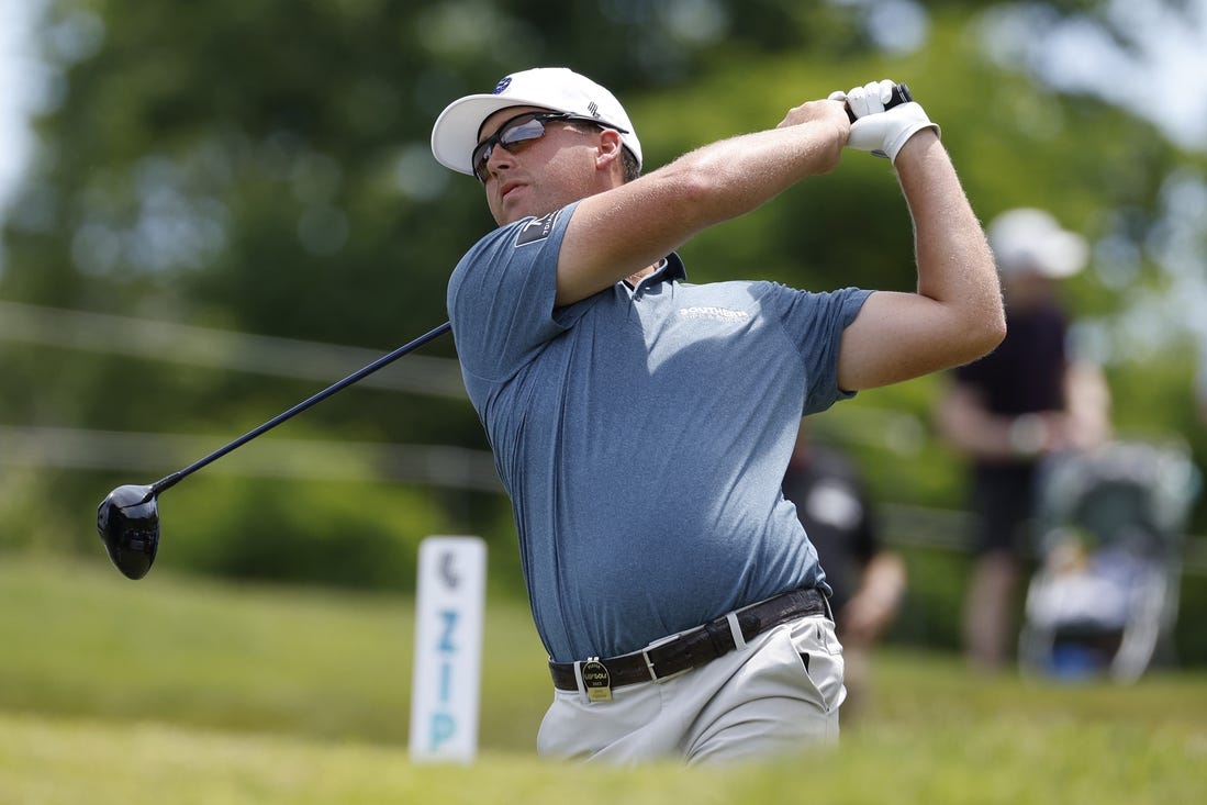 May 27, 2023; Potomac Falls, Virginia, USA; Andy Ogletree hits his tee shot on the second hole during the second round of LIV Golf Washington, D.C. golf tournament at Trump National. Mandatory Credit: Geoff Burke-USA TODAY Sports