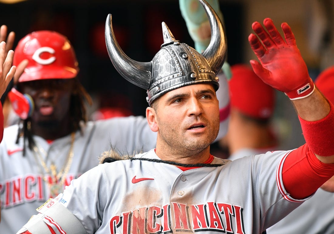 Jul 8, 2023; Milwaukee, Wisconsin, USA; Cincinnati Reds first baseman Joey Votto (19) celebrates his home run in the dugout against the Milwaukee Brewers in the fourth inning at American Family Field. Mandatory Credit: Michael McLoone-USA TODAY Sports