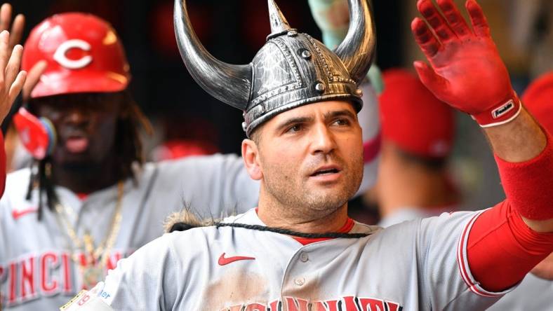 Jul 8, 2023; Milwaukee, Wisconsin, USA; Cincinnati Reds first baseman Joey Votto (19) celebrates his home run in the dugout against the Milwaukee Brewers in the fourth inning at American Family Field. Mandatory Credit: Michael McLoone-USA TODAY Sports