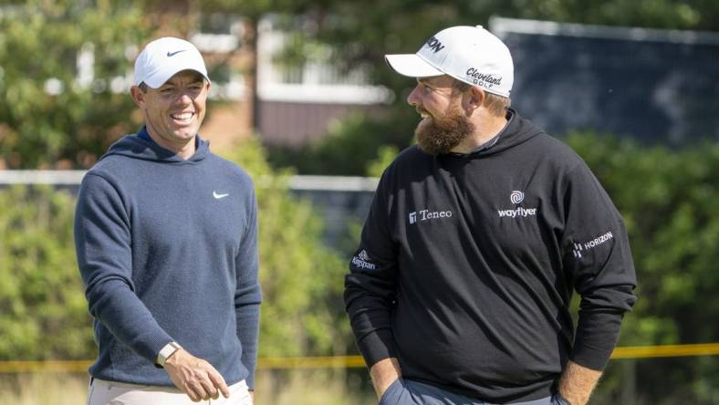 July 17, 2023; Hoylake, ENGLAND, GBR; Rory McIlroy (left) and Shane Lowry (right) smile on the fourth hole during a practice round of The Open Championship golf tournament at Royal Liverpool. Mandatory Credit: Kyle Terada-USA TODAY Sports