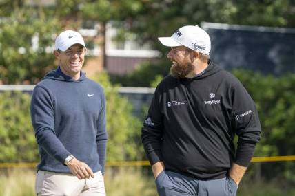 July 17, 2023; Hoylake, ENGLAND, GBR; Rory McIlroy (left) and Shane Lowry (right) smile on the fourth hole during a practice round of The Open Championship golf tournament at Royal Liverpool. Mandatory Credit: Kyle Terada-USA TODAY Sports