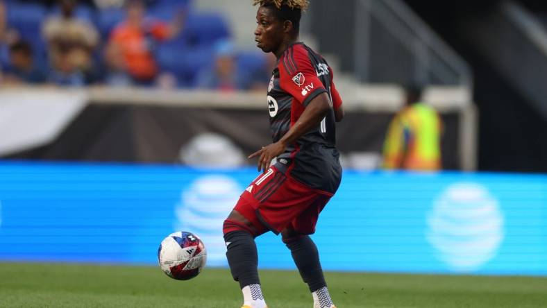 Jul 26, 2023; Harrison, NJ, USA; Toronto FC midfielder Latif Blessing (11) controls the ball against New York City FC during the first half at Red Bull Arena. Mandatory Credit: Vincent Carchietta-USA TODAY Sports