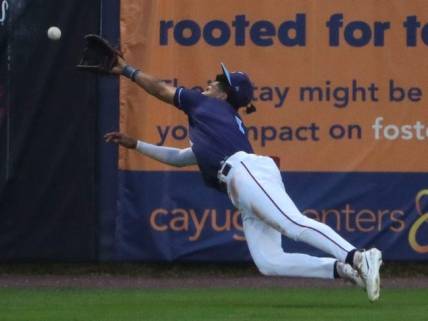 Wilmington's Daylen Lile dives but can't get to a long Renegade drive in the fourth inning of the Blue Rocks' 6-3 loss at Frawley Stadium, Friday, August 4, 2023.