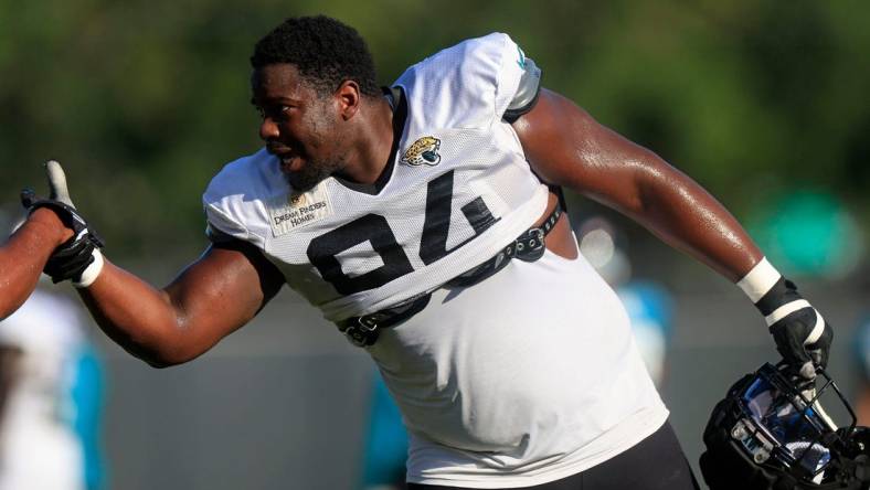 Jacksonville Jaguars defensive tackle Folorunso Fatukasi (94) greets defensive end Dawuane Smoot (91) Dawuane Smoot during training camp Monday, Aug. 7, 2023 at Miller Electric Center at EverBank Stadium in Jacksonville, Fla. This was the 11th day of training camp.