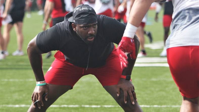 Wisconsin defensive line coach Greg Scruggs watches his players go through drills during practice on Sunday Aug. 6, 2023 at Pioneer Stadium in Platteville, Wis.