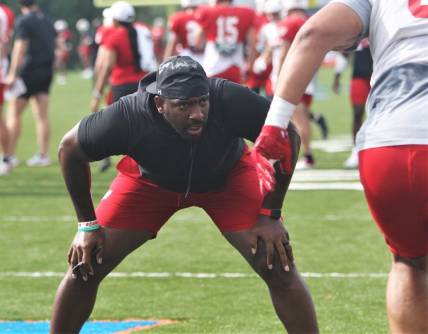 Wisconsin defensive line coach Greg Scruggs watches his players go through drills during practice on Sunday Aug. 6, 2023 at Pioneer Stadium in Platteville, Wis.