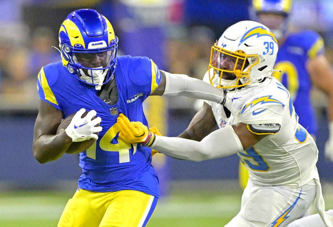 Aug 12, 2023; Inglewood, California, USA;   Los Angeles Rams wide receiver Tyler Johnson (14) is stopped by Los Angeles Chargers cornerback Michael Jacquet (39) after a first down in the second half at SoFi Stadium. Mandatory Credit: Jayne Kamin-Oncea-USA TODAY Sports