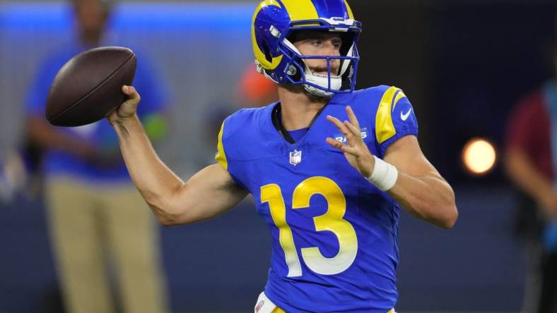 Aug 12, 2023; Inglewood, California, USA; Los Angeles Rams quarterback Stetson Bennett (13) throws the ball in the second half against the Los Angeles Chargers at SoFi Stadium. Mandatory Credit: Kirby Lee-USA TODAY Sports