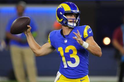 Aug 12, 2023; Inglewood, California, USA; Los Angeles Rams quarterback Stetson Bennett (13) throws the ball in the second half against the Los Angeles Chargers at SoFi Stadium. Mandatory Credit: Kirby Lee-USA TODAY Sports