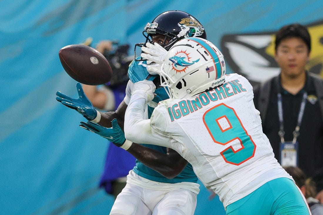 Aug 26, 2023; Jacksonville, Florida, USA;  Jacksonville Jaguars wide receiver Calvin Ridley (0) makes a catch defended by Miami Dolphins cornerback Noah Igbinoghene (9) in the second quarter at EverBank Stadium. Mandatory Credit: Nathan Ray Seebeck-USA TODAY Sports