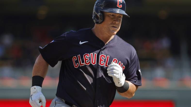 Aug 30, 2023; Minneapolis, Minnesota, USA; Cleveland Guardians first baseman Kole Calhoun (56) runs the bases on his three-run home run against the Minnesota Twins in the tenth inning at Target Field. Mandatory Credit: Bruce Kluckhohn-USA TODAY Sports